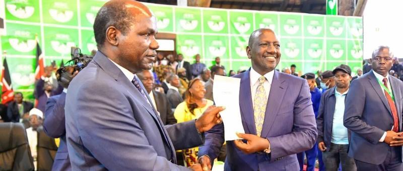 File Image of IEBC Chair Wafula Chebukati handing over victory certificate to President William Ruto